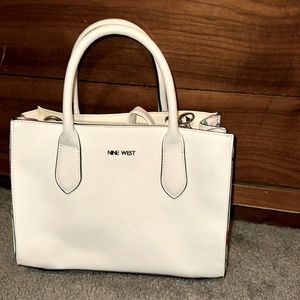 White purse with flower accents